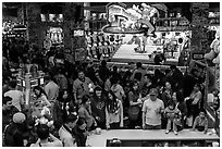 Families crowd arcade during holidays. Reno, Nevada, USA (black and white)
