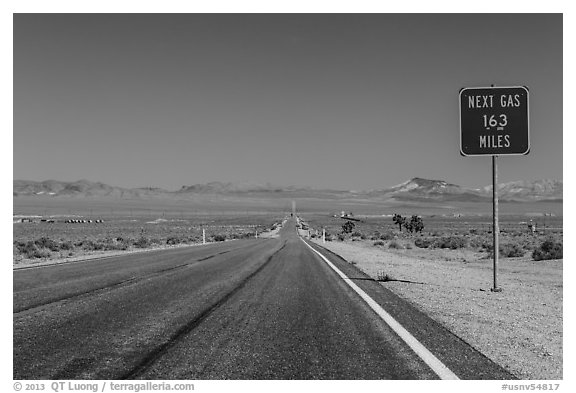 Highway and Next Gas 163 miles sign. Nevada, USA (black and white)