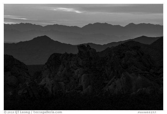 Whitney Pocket rocks and mountain ranges at sunset. Gold Butte National Monument, Nevada, USA (black and white)