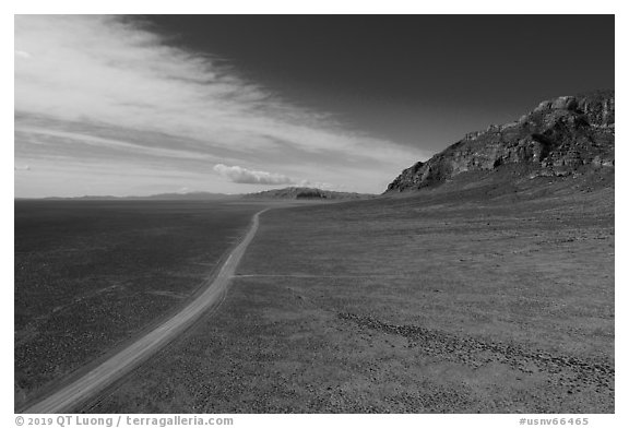 Aerial view of road through wide valley. Basin And Range National Monument, Nevada, USA (black and white)