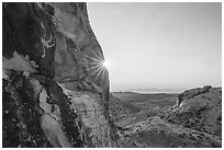 Falling Man petroglyph and sun. Gold Butte National Monument, Nevada, USA ( black and white)