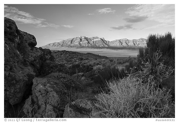 Ash boulders framing Worthington Mountains. Basin And Range National Monument, Nevada, USA