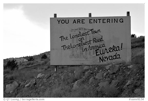 Loneliest town on the loneliest road sign. Nevada, USA (black and white)
