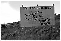 Loneliest town on the loneliest road sign. Nevada, USA (black and white)