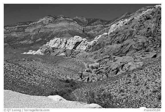 Red sandstone formations, and green hills, Red Rock Canyon. Red Rock Canyon, Nevada, USA (black and white)