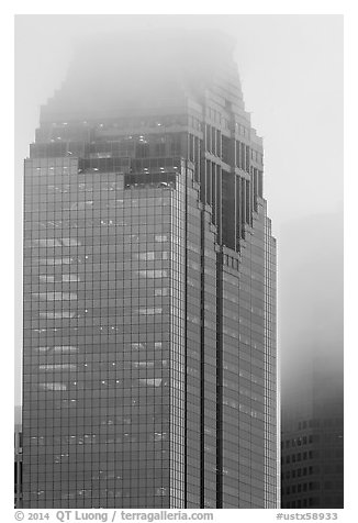 Top of skyscrapers capped in clouds. Houston, Texas, USA (black and white)