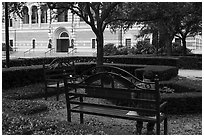 Man reading on bench, Rice University. Houston, Texas, USA ( black and white)