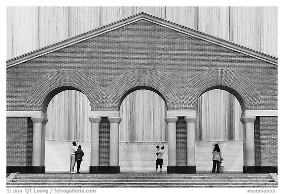 Gerald D. Hines Waterwall (Transco waterfall) and people. Houston, Texas, USA (black and white)