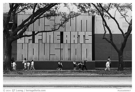 Children strolling in front of Museum of Fine Arts. Houston, Texas, USA (black and white)