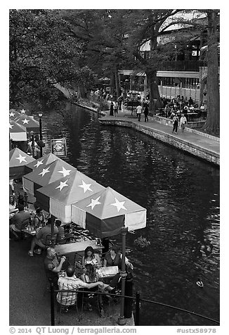 Restaurant tables under Texas flag umbrellas. San Antonio, Texas, USA (black and white)