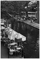 Restaurant tables under Texas flag umbrellas. San Antonio, Texas, USA ( black and white)