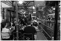 Enjoying drinks on Riverwalk. San Antonio, Texas, USA ( black and white)