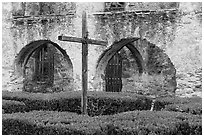 Cross in courtyard, Mission San Jose. San Antonio, Texas, USA ( black and white)