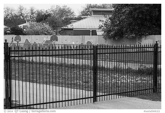 Fence with landscape mural decor. San Antonio, Texas, USA (black and white)