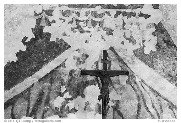 Fading fresco and crucifix. San Antonio, Texas, USA (black and white)