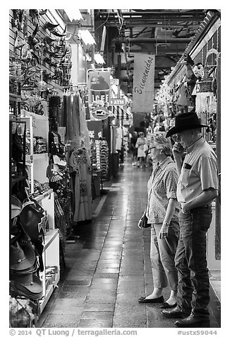 Man with cowboy hat and woman look at crafts, Market Square. San Antonio, Texas, USA (black and white)