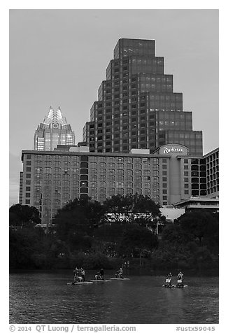 Water bicycles on Colorado River at dusk. Austin, Texas, USA (black and white)