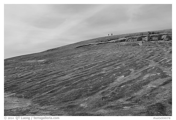 Granite dome with hikers, Enchanted Rock. Texas, USA (black and white)