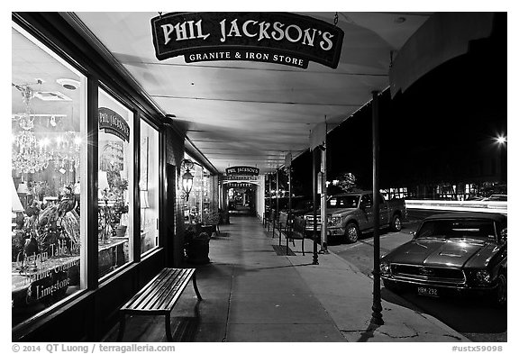 Sidewalk at night. Fredericksburg, Texas, USA (black and white)