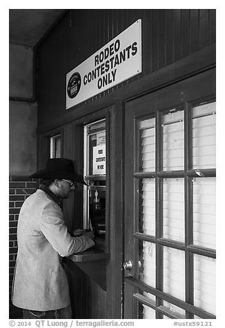 Man registers as rodeo contestant, Stockyards. Fort Worth, Texas, USA (black and white)