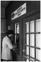 Man registers as rodeo contestant, Stockyards. Fort Worth, Texas, USA ( black and white)