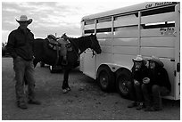 Group talking next to horse and trailer. Fort Worth, Texas, USA ( black and white)