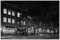 Street at night with lighted stores. Fort Worth, Texas, USA ( black and white)