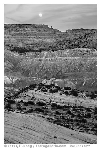 Moon rising over colorful rocks of the Cockscomb. Grand Staircase Escalante National Monument, Utah, USA (black and white)