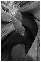 Sculpted sandstone walls and small arch, Peek-a-Boo slot canyon. Grand Staircase Escalante National Monument, Utah, USA ( black and white)