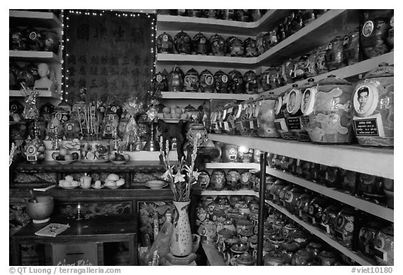 Temple room containing funeral urns with ashes of the deceased. Ho Chi Minh City, Vietnam (black and white)