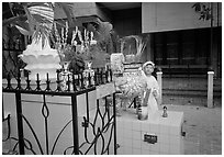 Kid in mourning dress at an outdoor altar, Xa Loi pagoda, district 3. Ho Chi Minh City, Vietnam (black and white)