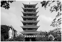 Eight-story tower of Vinh Ngiem pagoda, district 3. Ho Chi Minh City, Vietnam ( black and white)