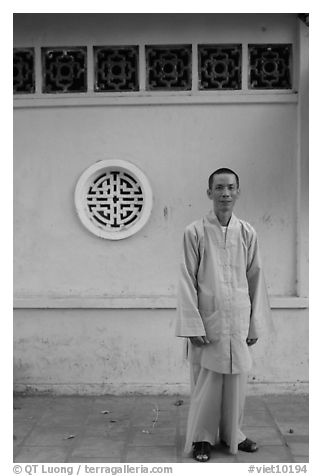 Monk standing outside Giac Vien Pagoda, district 11. Ho Chi Minh City, Vietnam (black and white)