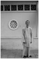 Monk standing outside Giac Vien Pagoda, district 11. Ho Chi Minh City, Vietnam (black and white)