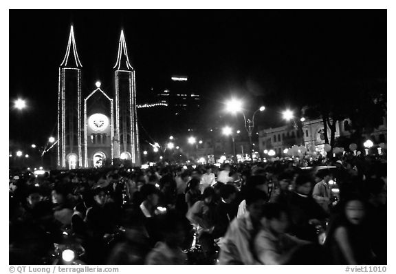Crowds gather in front of the Cathedral St Joseph for Christmans. Ho Chi Minh City, Vietnam (black and white)