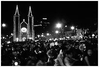 Crowds gather in front of the Cathedral St Joseph for Christmans. Ho Chi Minh City, Vietnam (black and white)