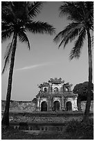 Palm trees and gate, Hue citadel. Hue, Vietnam (black and white)