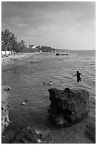 Child jumping in water, Duong Dong. Phu Quoc Island, Vietnam (black and white)