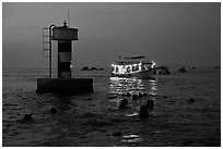 Lighted boat a dusk. Phu Quoc Island, Vietnam ( black and white)