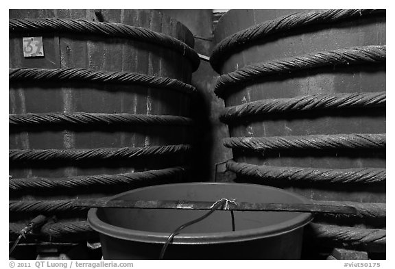 Manufacturing of fish sauce, Duong Dong. Phu Quoc Island, Vietnam (black and white)