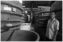 Worker in fish sauch factory, Duong Dong. Phu Quoc Island, Vietnam (black and white)