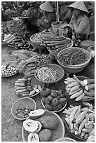 Women selling fruit and vegetables at market, Duong Dong. Phu Quoc Island, Vietnam (black and white)