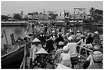 Crowd crossing the mobile bridge, Duong Dong. Phu Quoc Island, Vietnam (black and white)