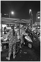 Street food stand at night. Ho Chi Minh City, Vietnam ( black and white)