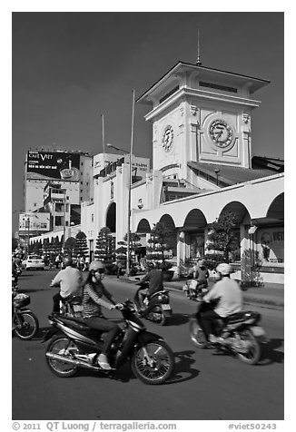 Chaotic motorcycle traffic outside Ben Thanh Market. Ho Chi Minh City, Vietnam (black and white)