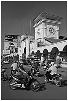 Chaotic motorcycle traffic outside Ben Thanh Market. Ho Chi Minh City, Vietnam ( black and white)