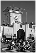 Motorbike traffic and Ben Thanh Market. Ho Chi Minh City, Vietnam (black and white)