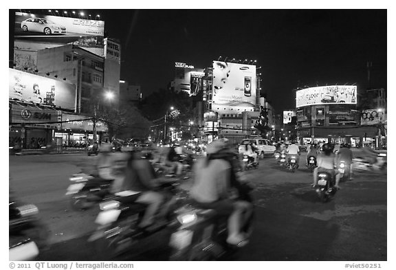 Moving traffic at night on traffic circle. Ho Chi Minh City, Vietnam (black and white)