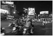 Moving traffic at night on traffic circle. Ho Chi Minh City, Vietnam (black and white)
