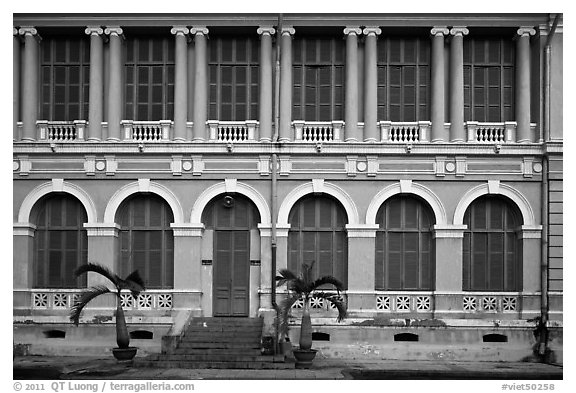 Facade of courthouse with blue doors and windows. Ho Chi Minh City, Vietnam (black and white)